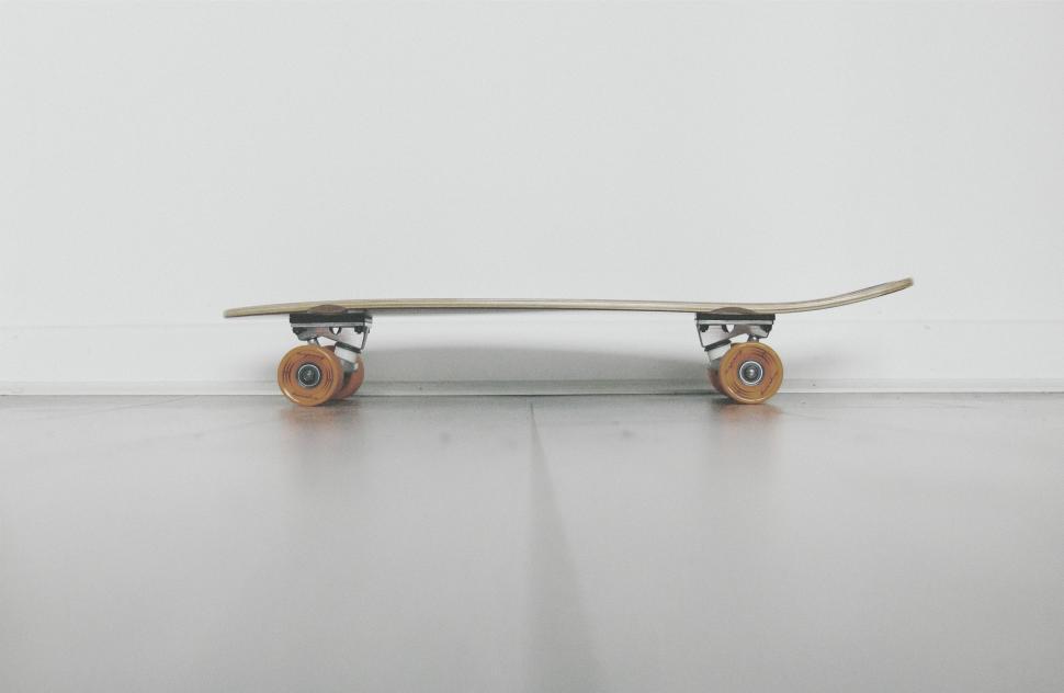 Free Image of Skateboard on White Floor 