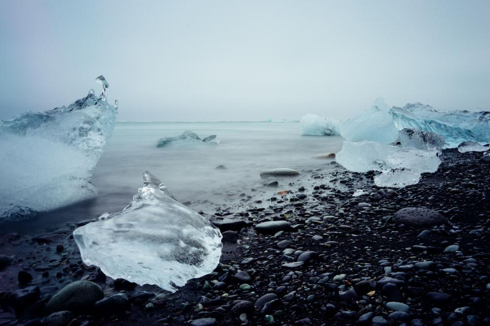 Free Image of Icebergs On the Shore of a Rocky Beach 