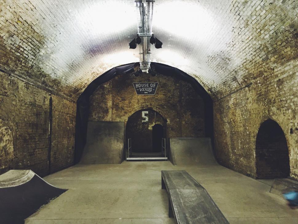 Free Image of Skateboarder Descending Ramp in Tunnel 