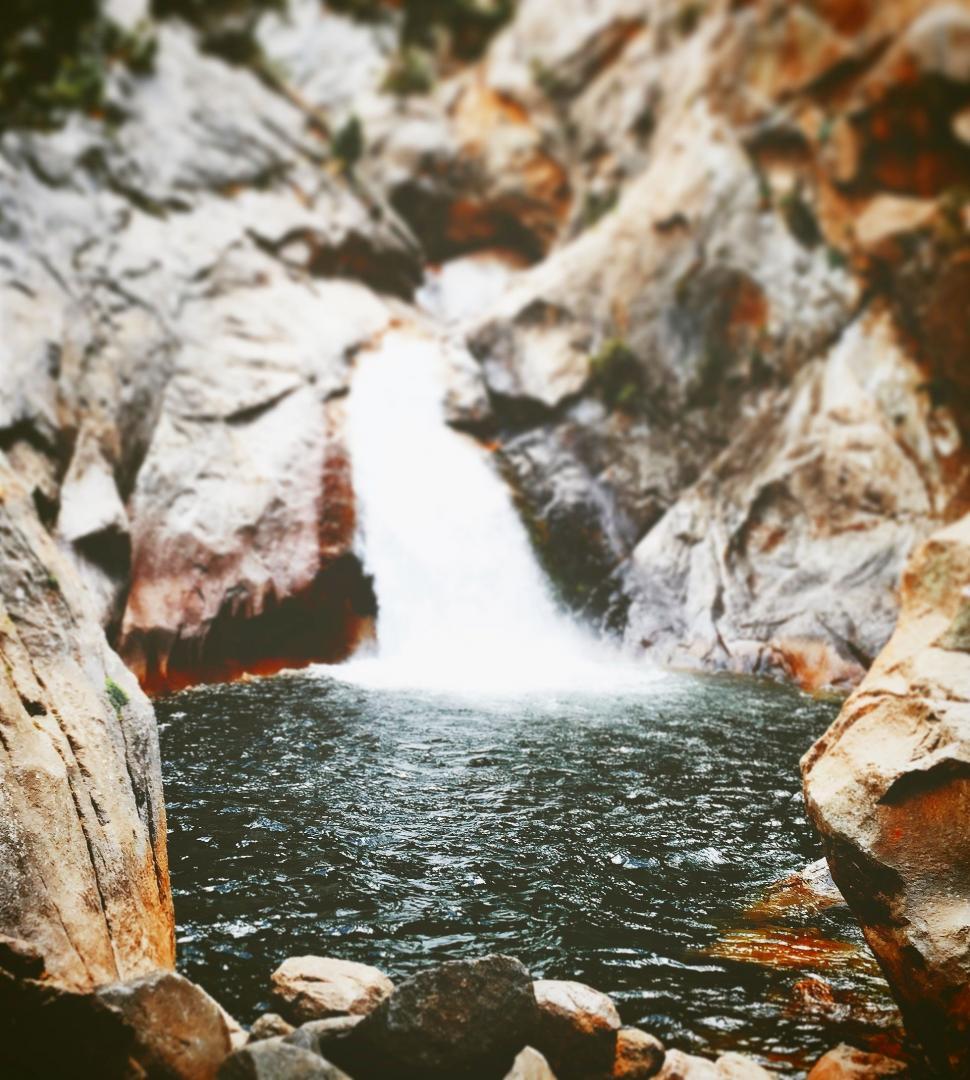 Free Image of Small Waterfall Amidst Rocks 