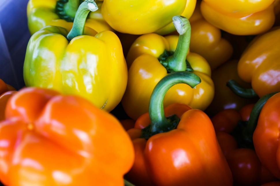 Free Image of Blue Container Filled With Yellow and Red Peppers 