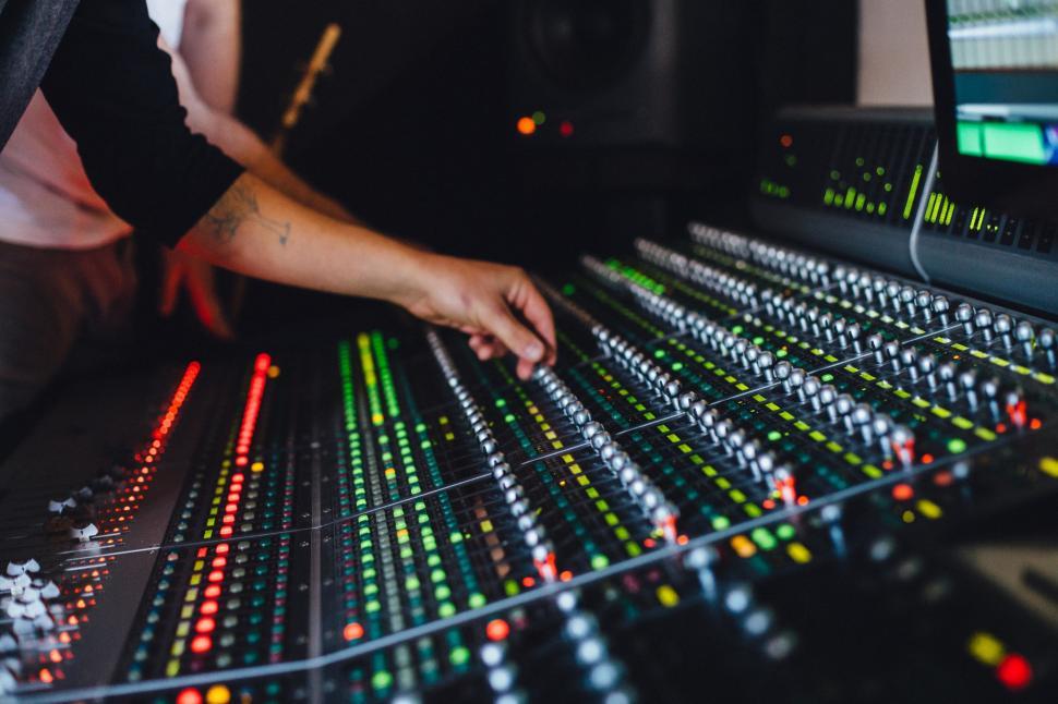 Free Image of Man Operating Sound Board in Recording Studio 