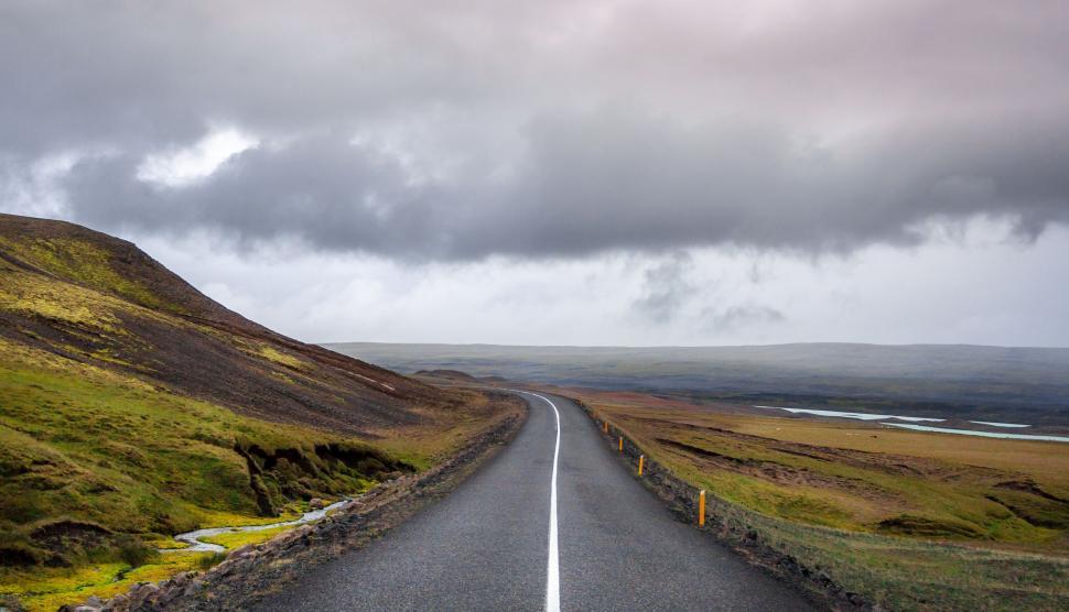 Free Image of Empty Road With Hill in Background 