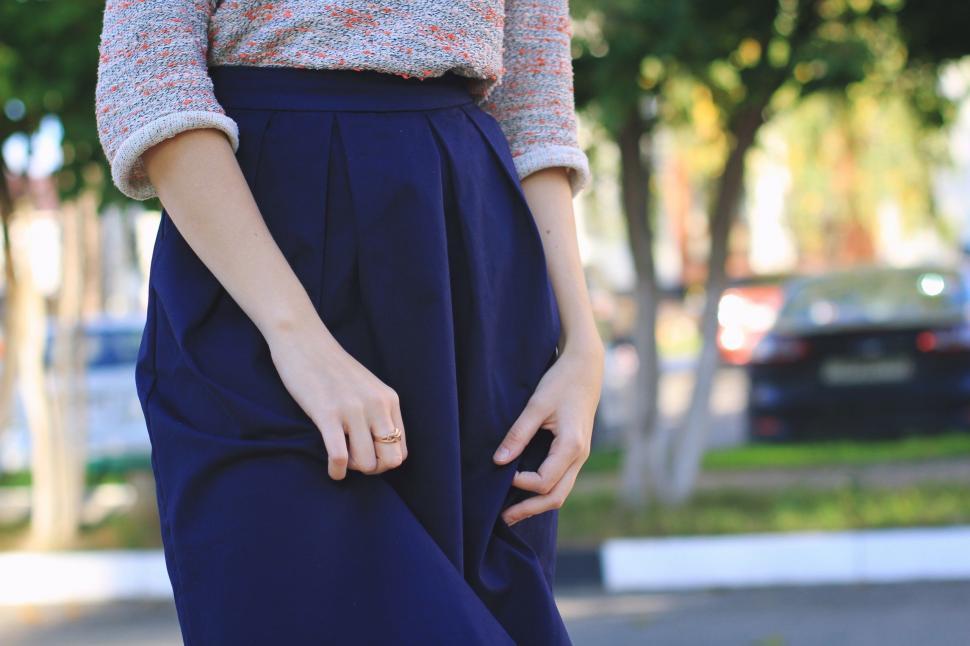 Free Image of Woman Wearing Blue Skirt and Sweater 
