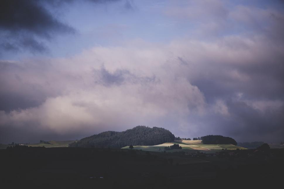 Free Image of Cloudy Sky With Distant Mountain 