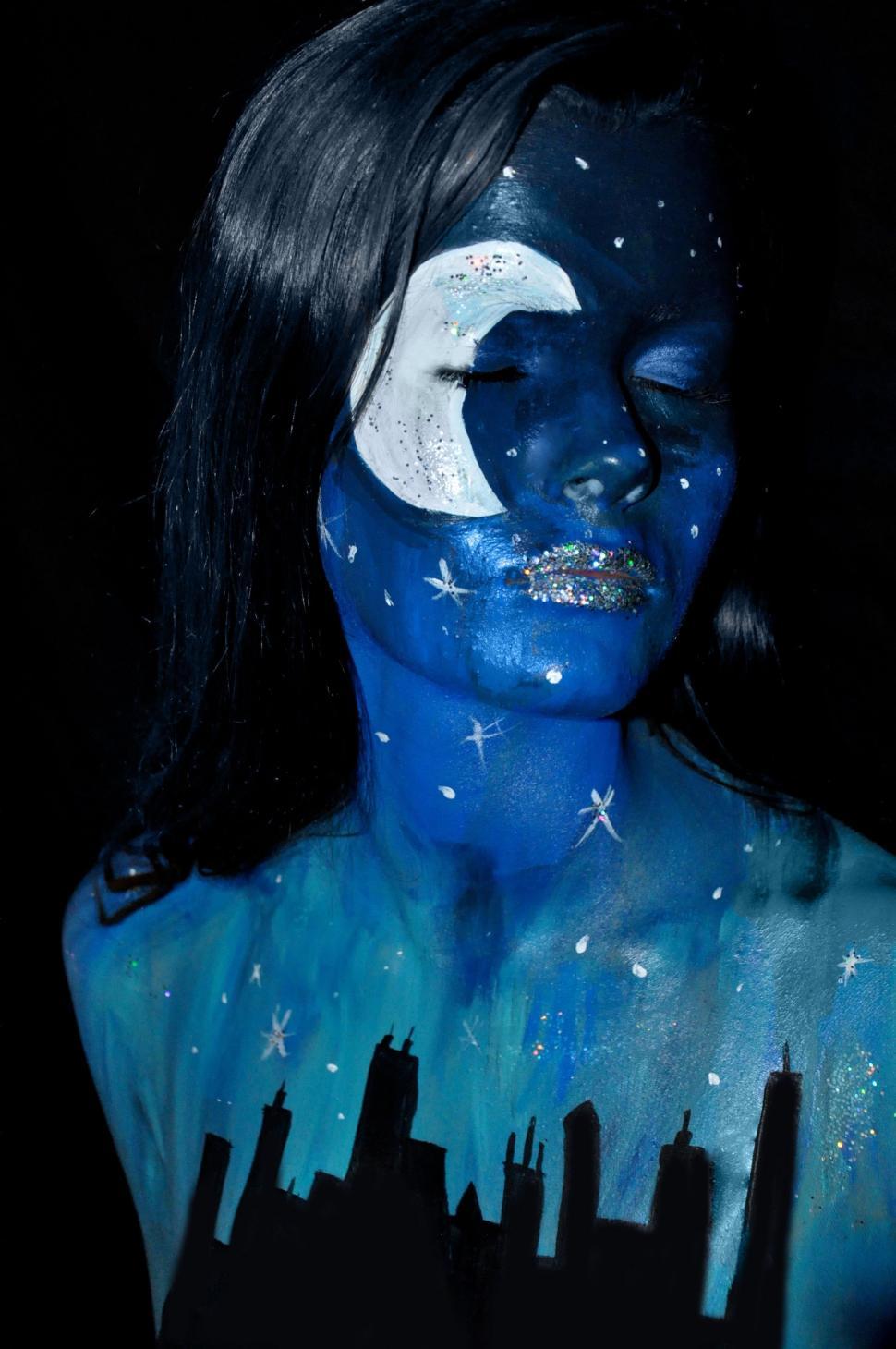 Free Image of Woman With Painted Face and Body Looking at Camera 