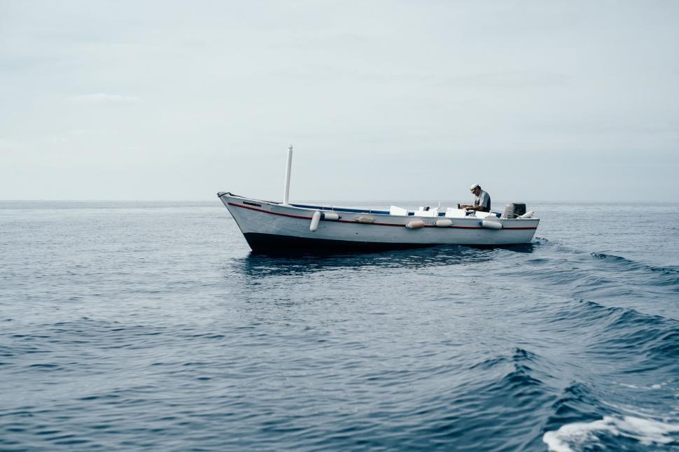 Free Image of Boat Floating on Large Body of Water 