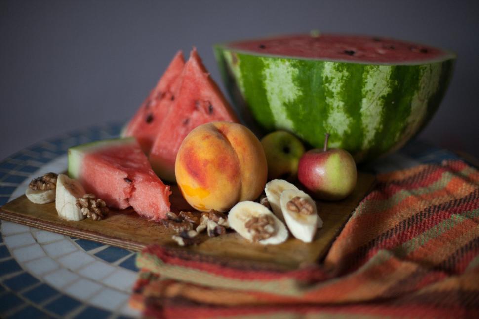 Free Image of Wooden Cutting Board With Slices of Watermelon 