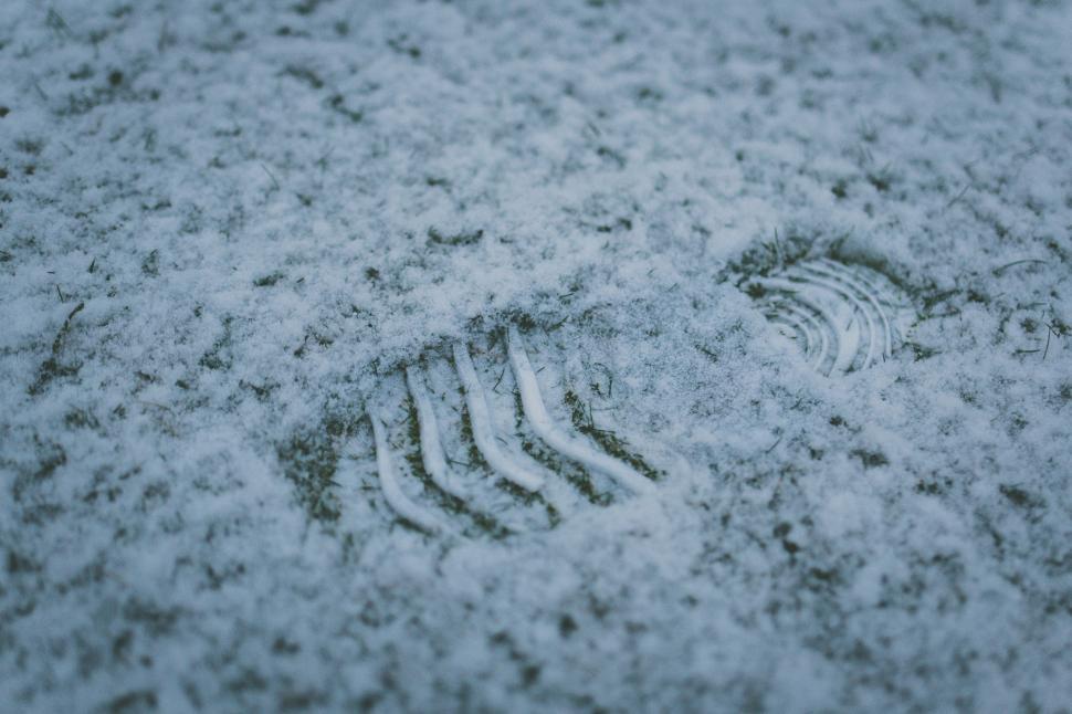 Free Image of Footprints on Snow Covered Ground 