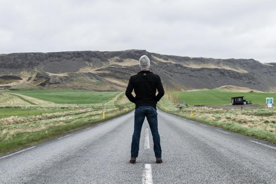 Free Image of Man Standing in the Middle of a Road 