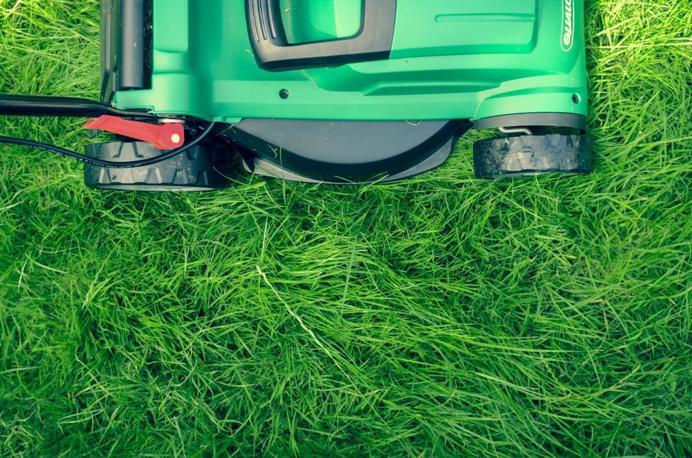 Free Image of Green Lawn Mower on Lush Field 