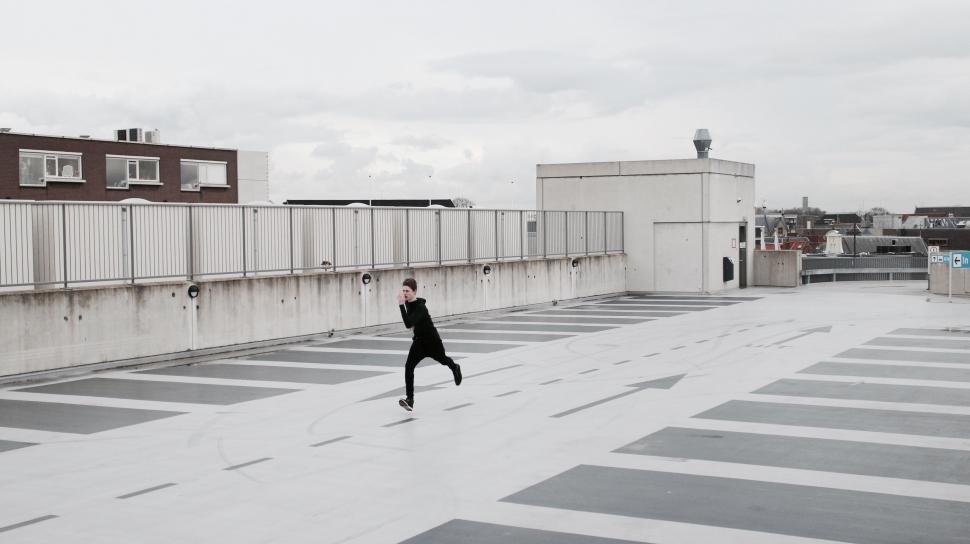 Free Image of Person Standing on Roof 