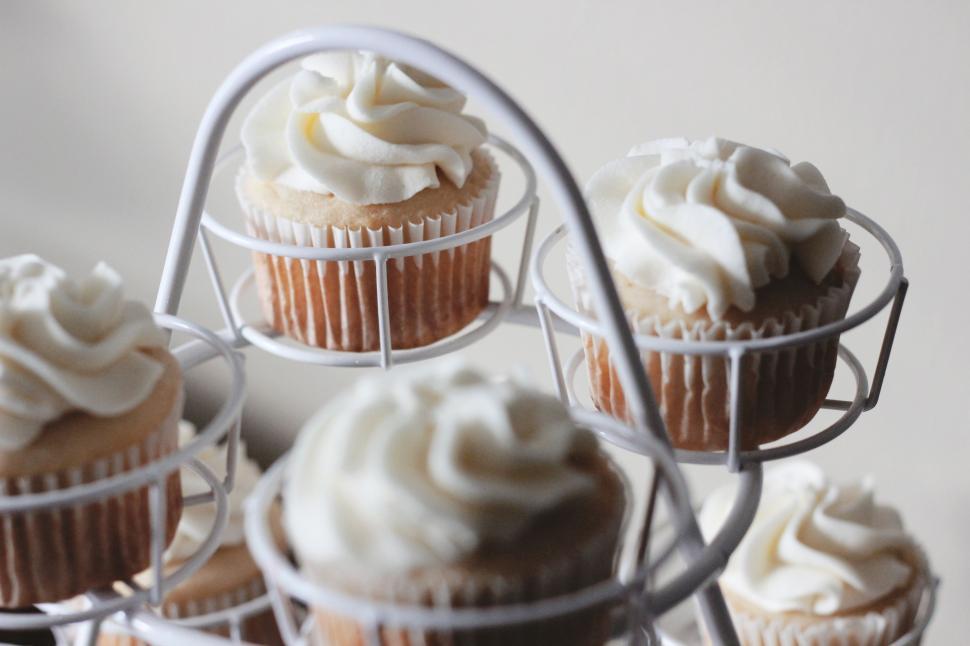 Free Image of Assorted Cupcakes Arranged on a Cooling Rack 