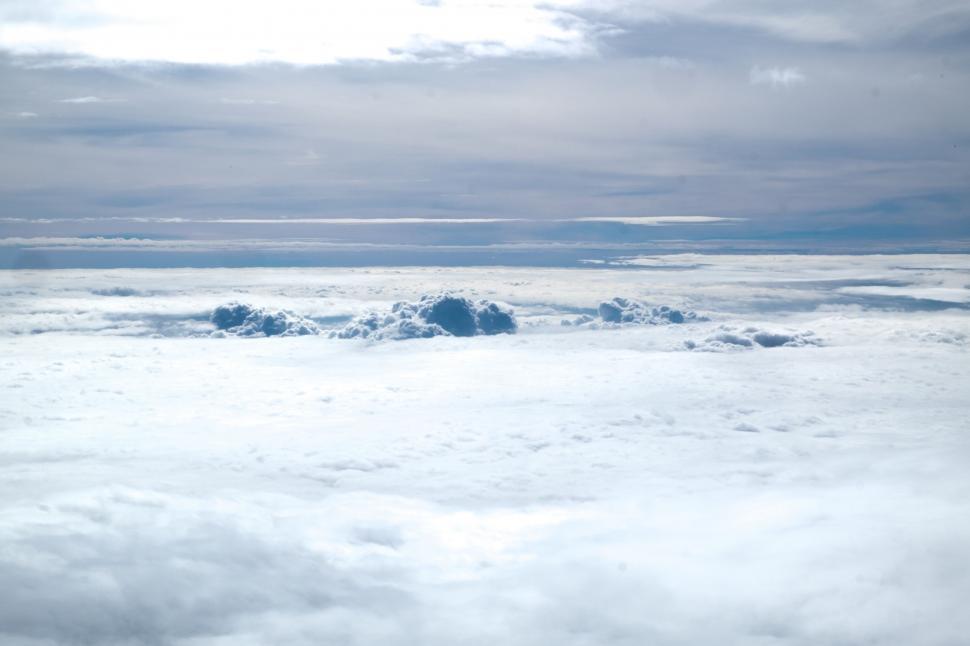 Free Image of A View of Clouds and Mountains From an Airplane 
