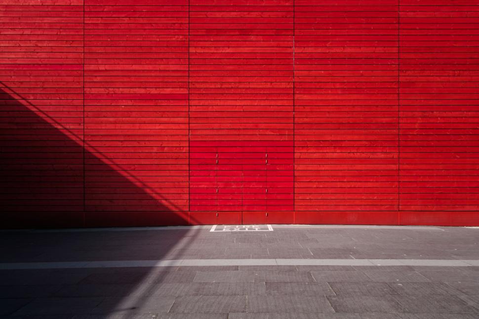 Free Image of Red Wall With Shadow of Person 