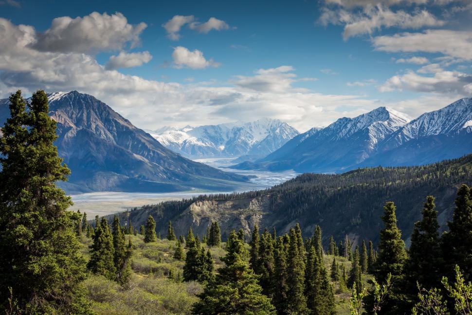Free Image of Majestic Mountain Range With Trees in Foreground 