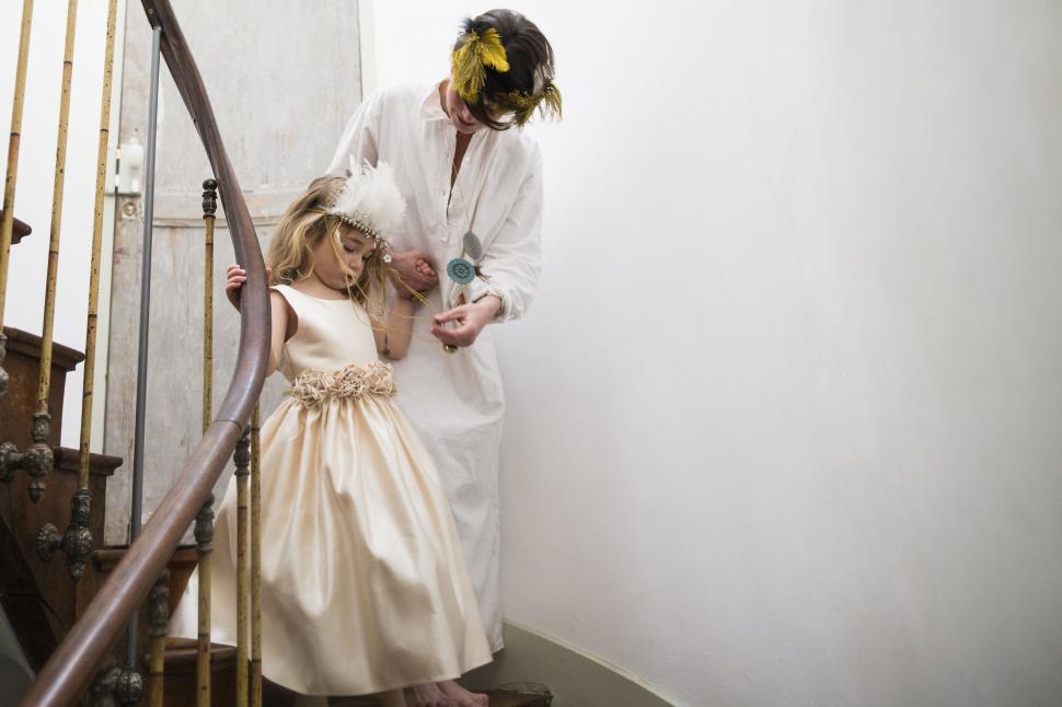Free Image of Man in White Lab Coat and Girl in White Dress 