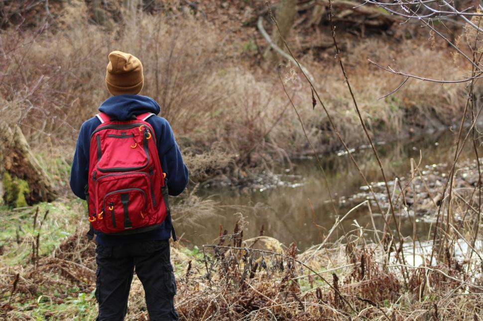 Free Image of Person With Backpack Observing Stream 