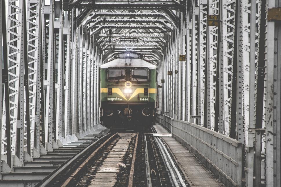 Free Image of A Train Approaching on Railroad Tracks 