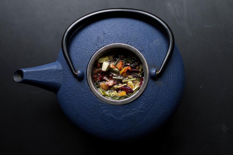 Free Image of Blue Tea Pot Filled With Food on Table 