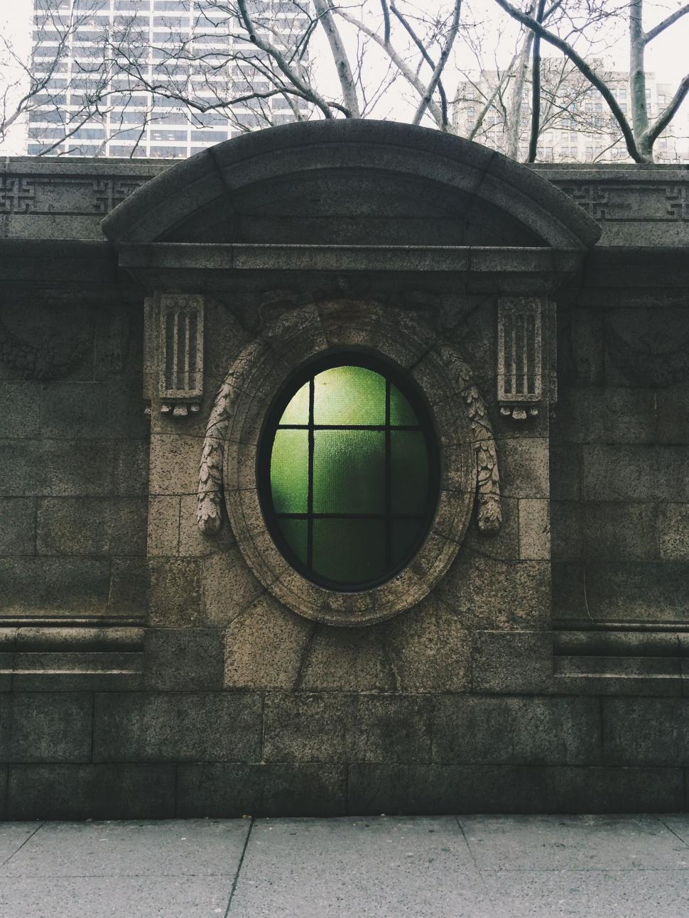 Free Image of Stone Building With Circular Window 