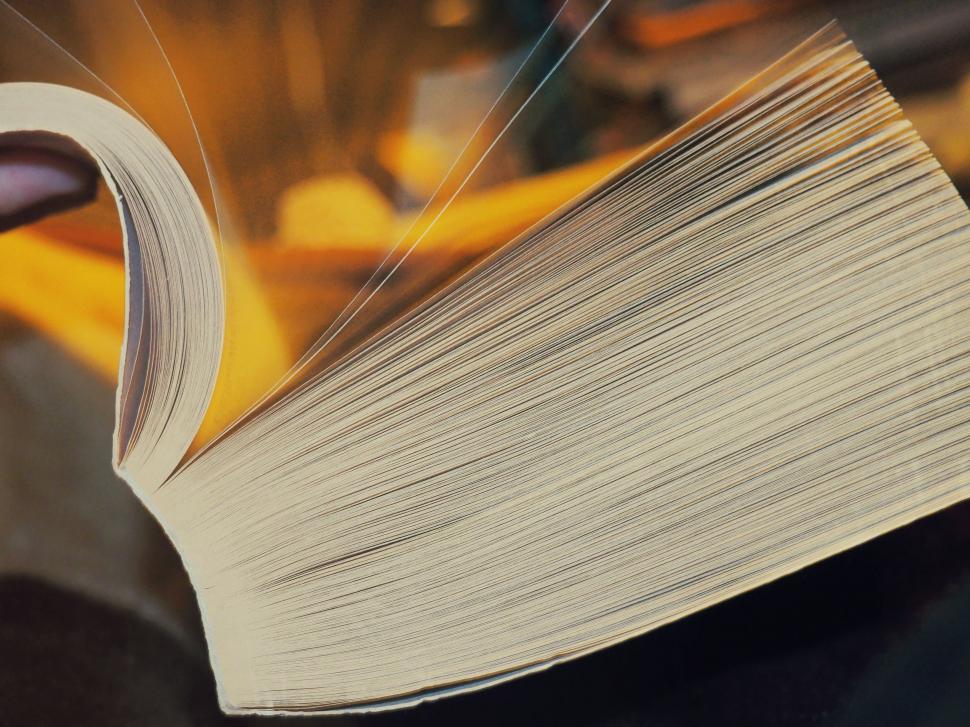 Free Image of Close Up of an Open Book on a Table 