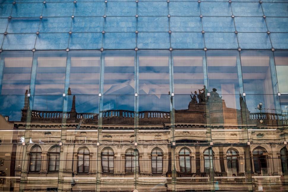 Free Image of Building Reflection in Glass Window 