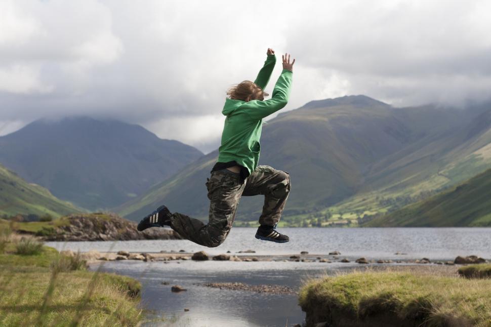 Free Image of Person Jumping Near Body of Water 