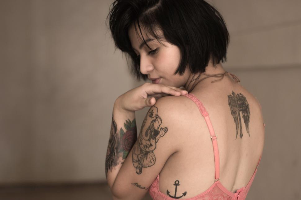 Free Image of Woman With Tattoo on Her Back 