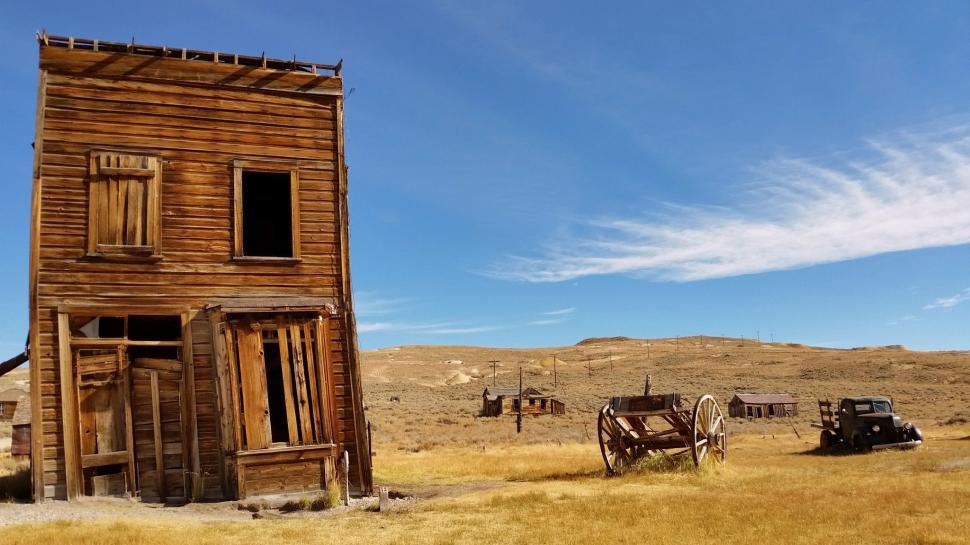 Free Image of Old Wooden Building in Middle of Field 