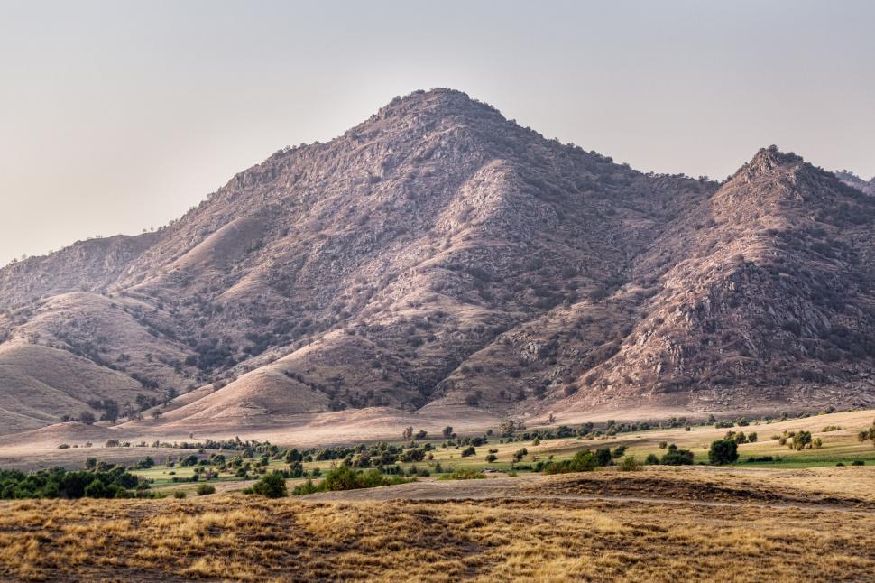 Free Image of Mountain Range Emerging in Desert Landscape 