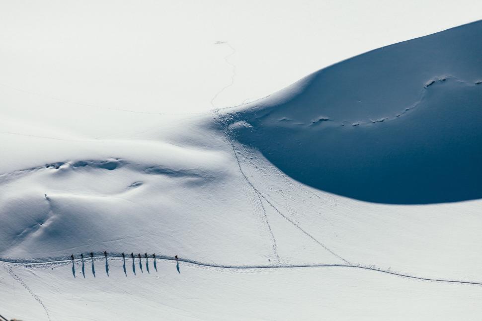 Free Image of Snow Covered Hill With Fence 