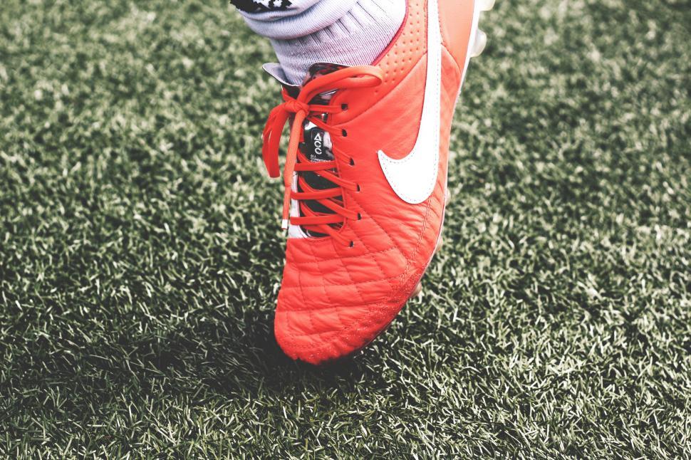 Free Image of Close Up of Soccer Players Shoes on Field 