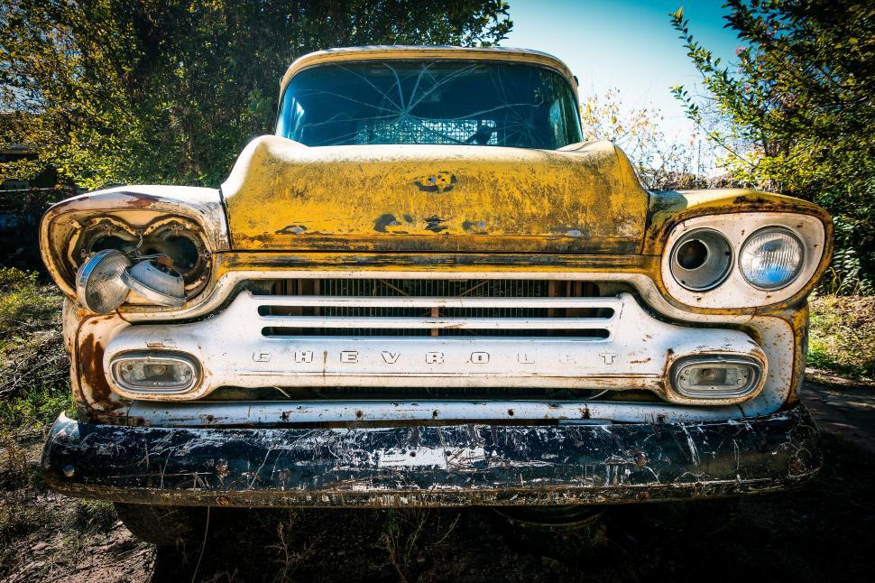 Free Image of Old Yellow Truck Parked in Field 