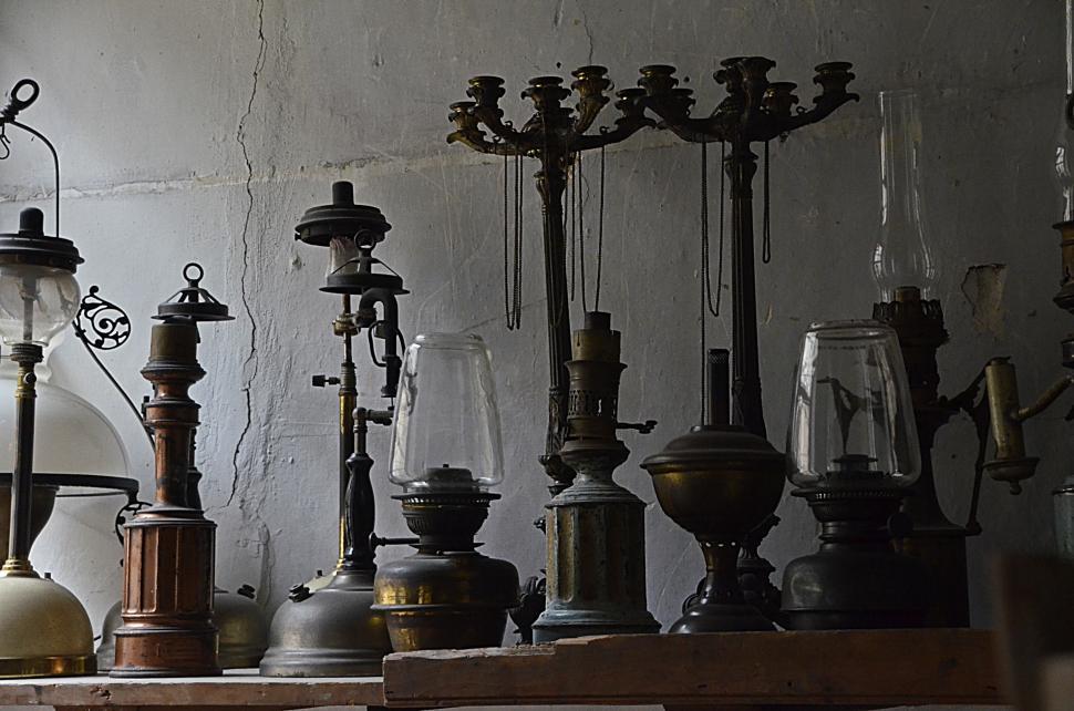 Free Image of Collection of Old Fashioned Lamps on a Shelf 