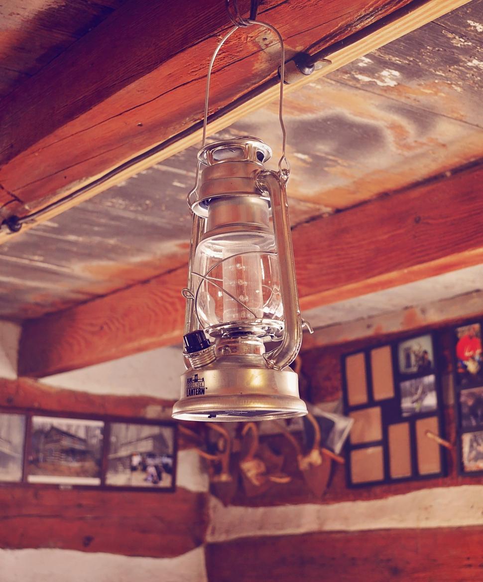 Free Image of Lantern Hanging From the Ceiling of a Cabin 