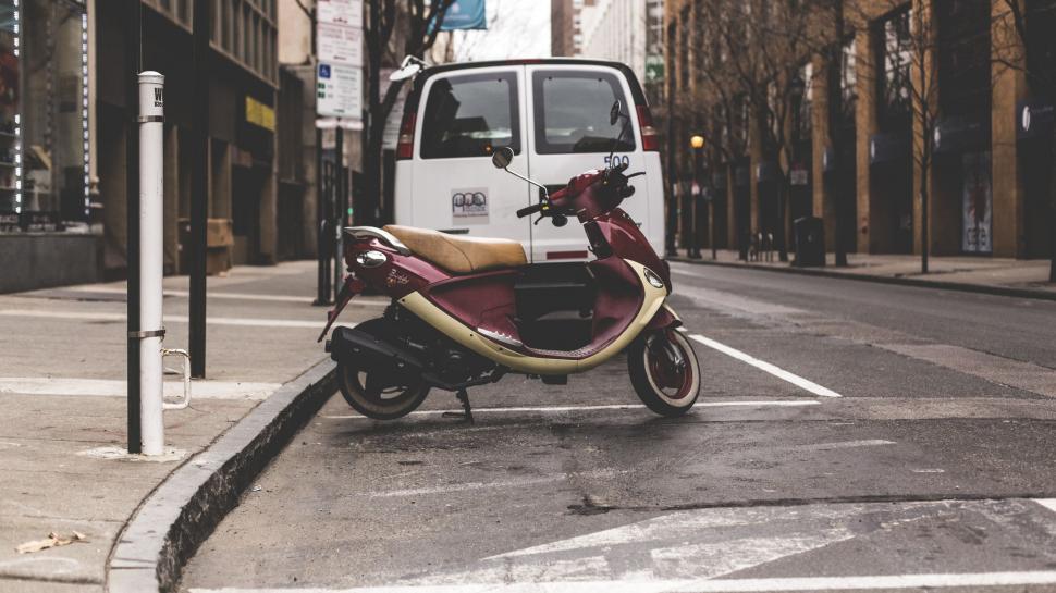 Free Image of Motor Scooter Parked on Side of Road 