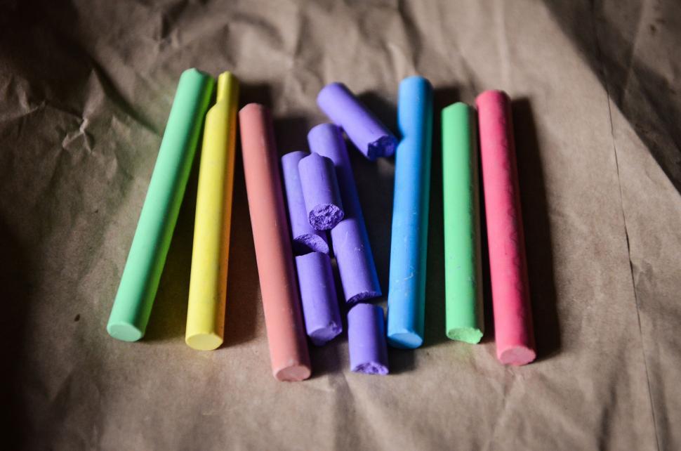Free Image of Colored Sticks on Sheet of Paper. 