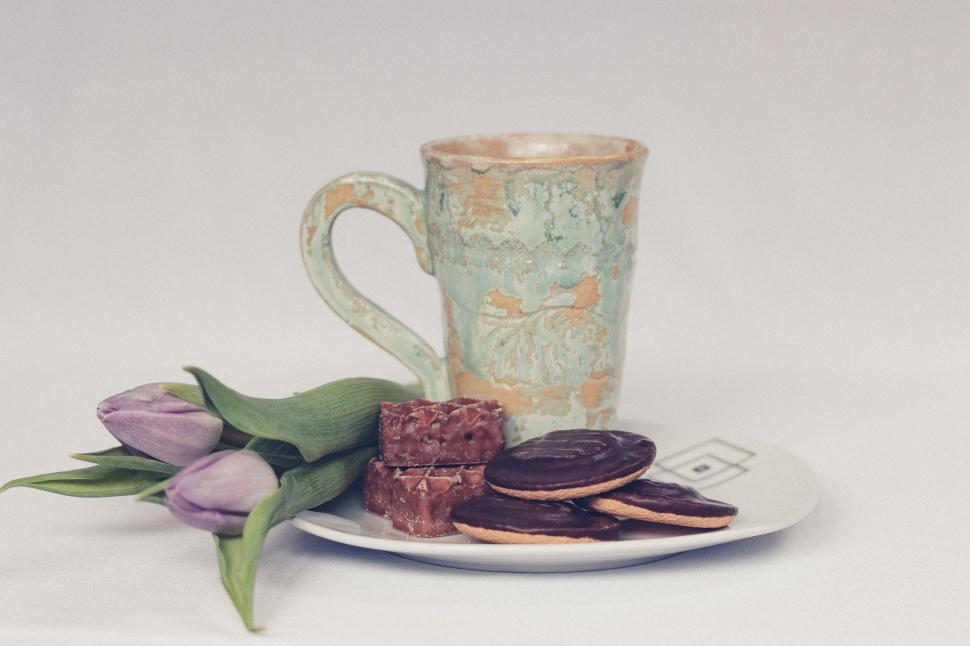Free Image of A Cup of Coffee and Cookies on a Plate 