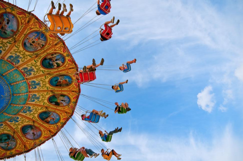 Free Image of Thrilling Carnival Ride With Excited People 