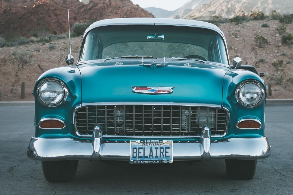 Free Image of Old Blue Car Parked in Parking Lot 