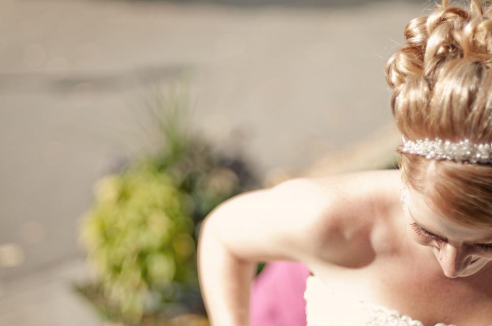 Free Image of A Woman in a Wedding Dress With a Tiara 