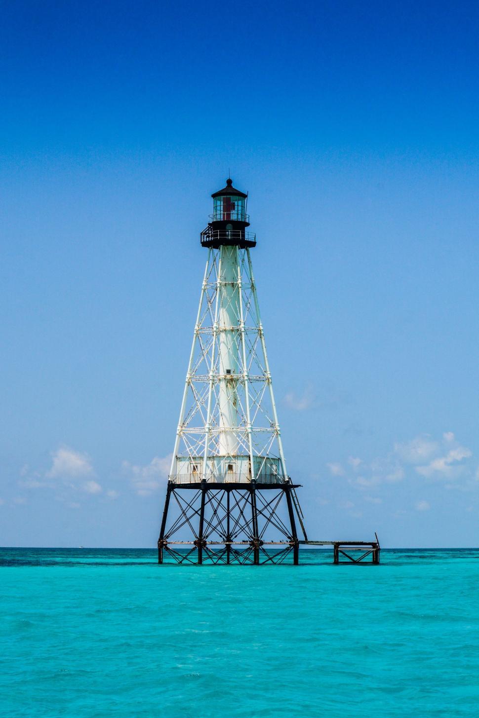 Free Image of Lighthouse Standing in the Ocean 