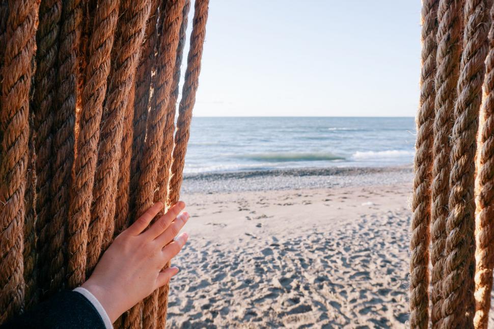 Free Image of Person Holding Rope on Beach 