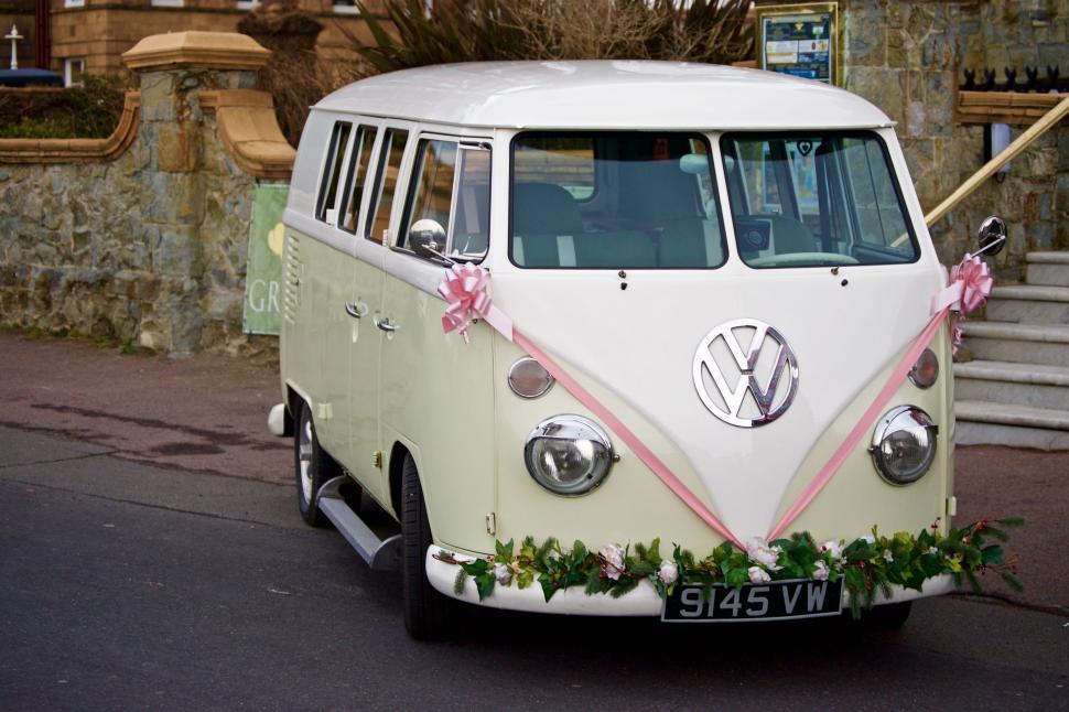Free Image of VW Bus Decorated With Flowers and Ribbons 