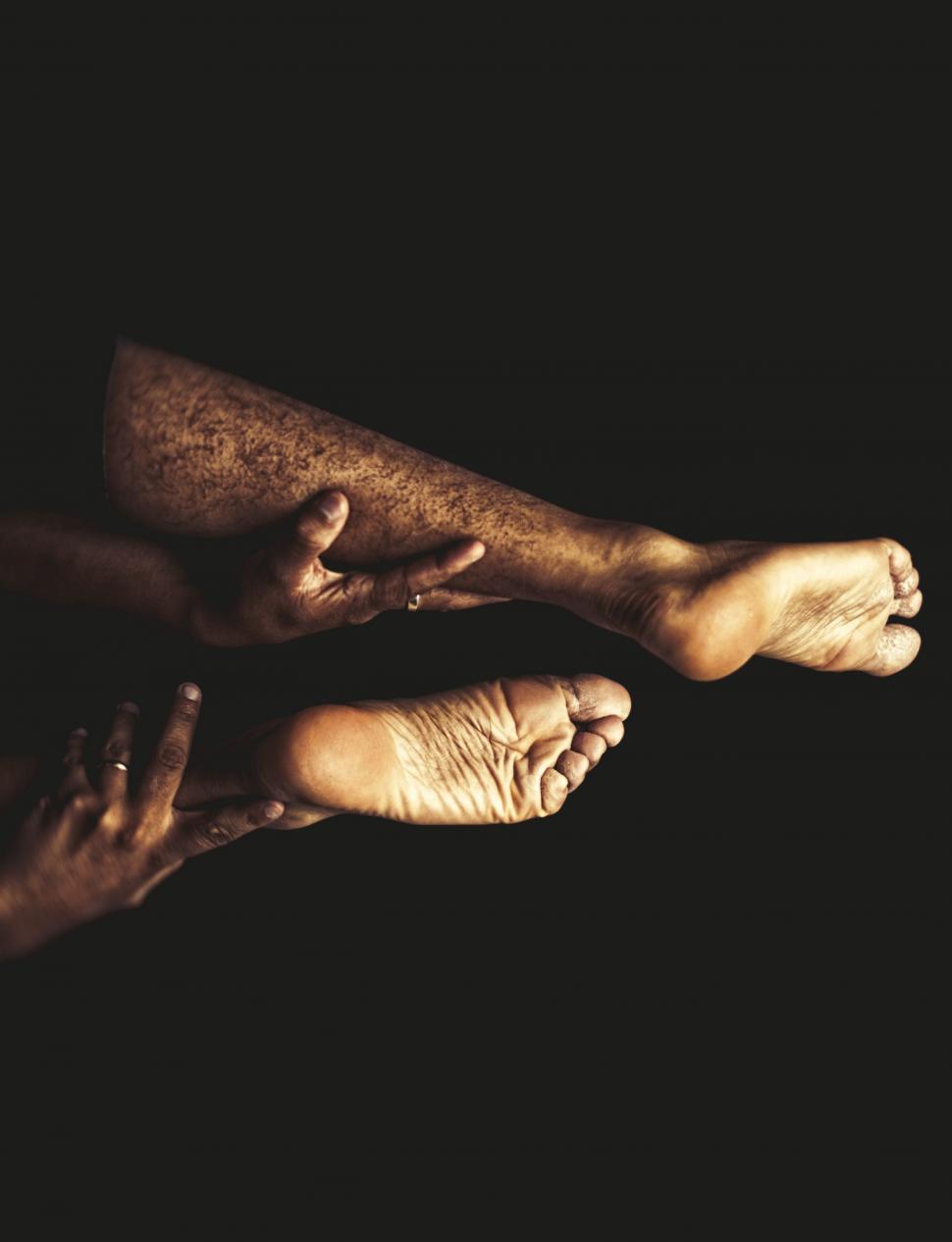 Free Image of Hands Holding Human Foot in Medical Examination 