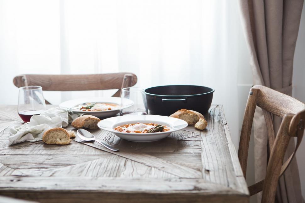 Free Image of Wooden Table With Plates of Food 