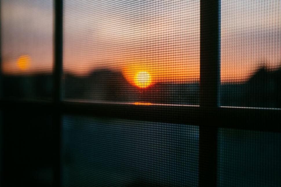 Free Image of Window With a View of a Sunset 
