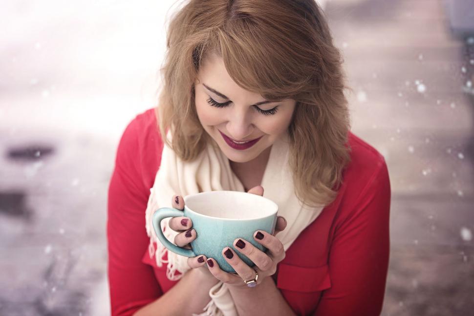 Free Image of Woman Holding Cup 