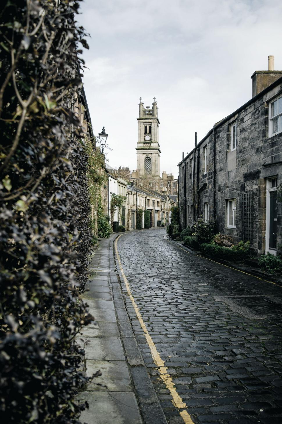 Free Image of Historic Cobblestone Street With Clock Tower 
